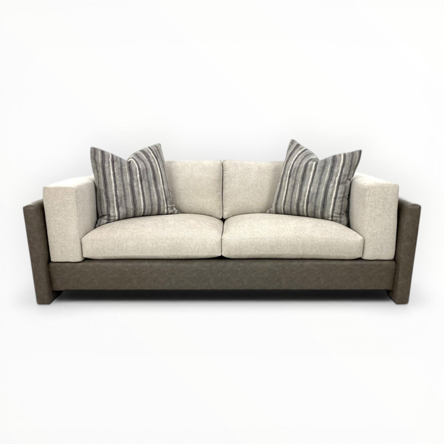 Ikat Stripe throw pillows shown on modern sofa
