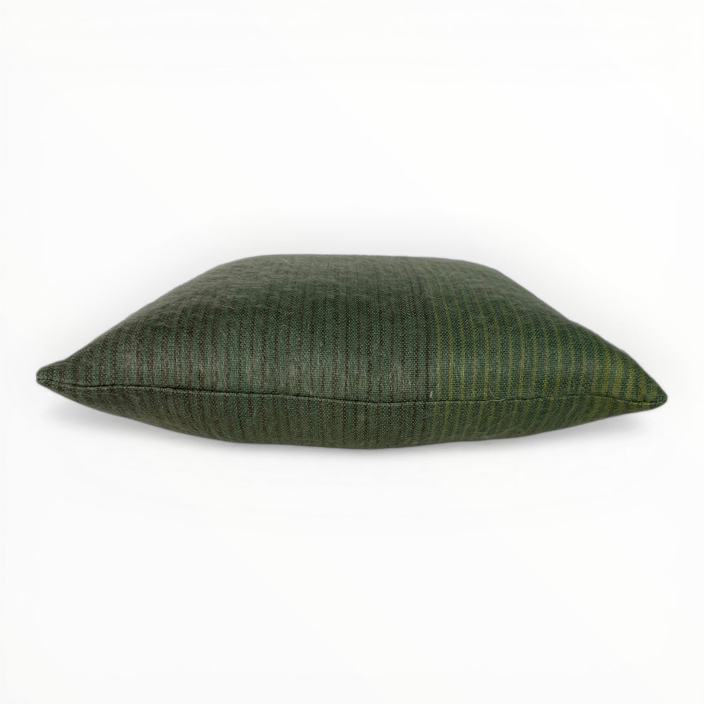 neutral interior styled with green textured pillow