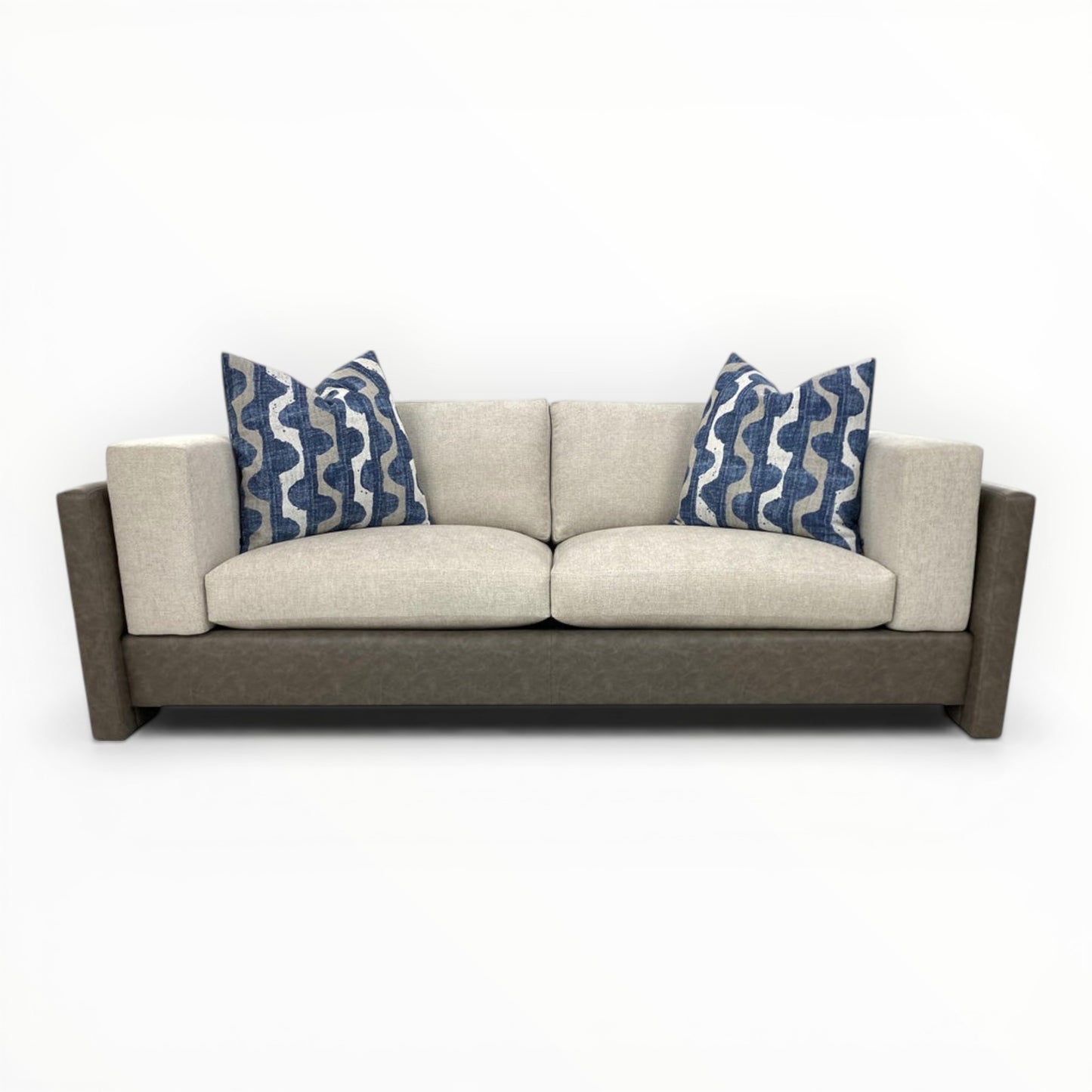 Robert Allen Lagan Azure throw pillows shown on a modern neutral sofa