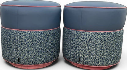 Pillowfina slate blue leather ottoman/stools with peacock woven lacing and watermelon velvet welt trim.