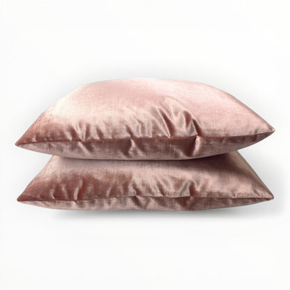 coral velvet throw pillow with warm tone and soft sheen