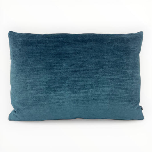 Dekortex electra bermuda velvet throw pillow cover in deep blue on sofa