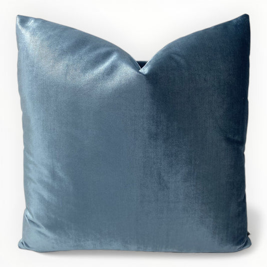 designer blue velvet throw pillow covers on neutral sofa