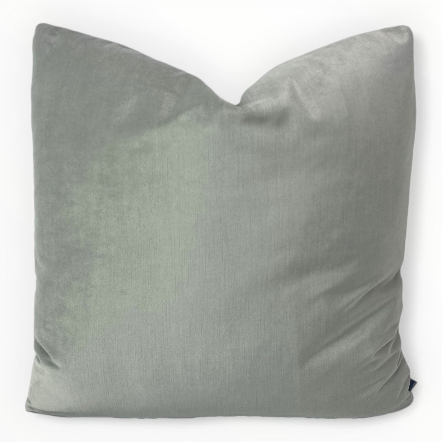 designer pale jade velvet throw pillow cover on neutral sofa