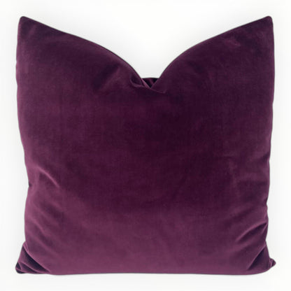 designer raspberry velvet throw pillow cover on neutral sofa