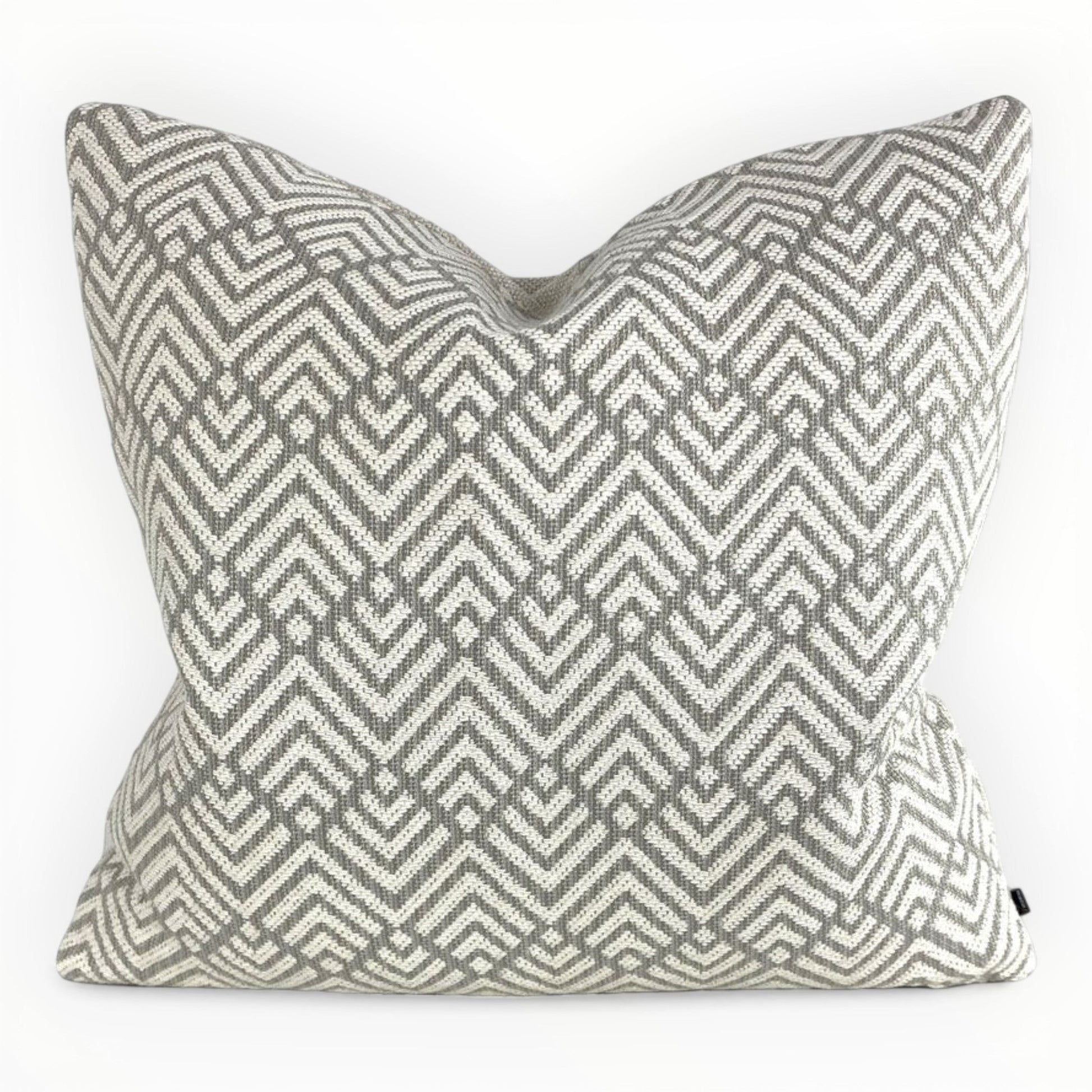 designer taupe knit throw pillow cover on neutral sofa with textured pattern