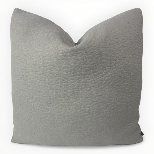Duralee grey quilted leaf throw pillow cover on neutral sofa