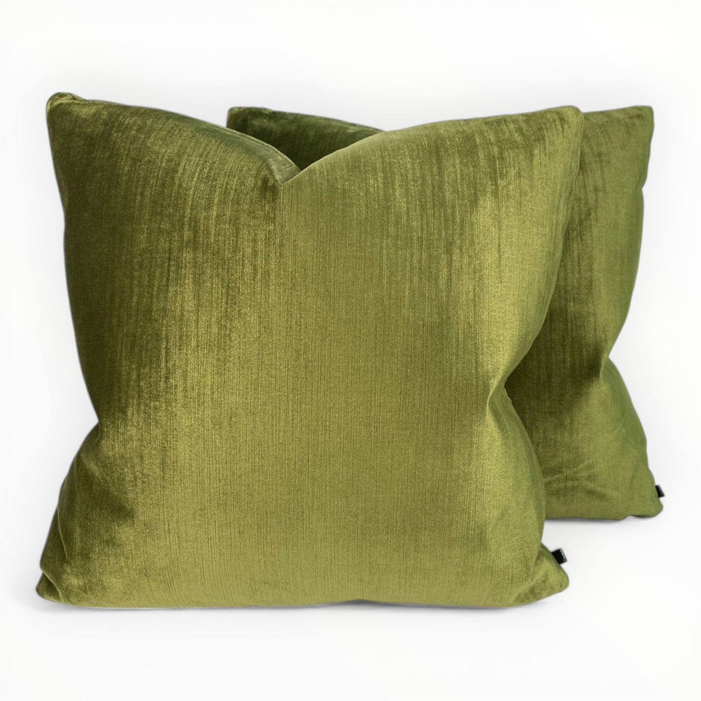 modern interior styled with olive green velvet pillows