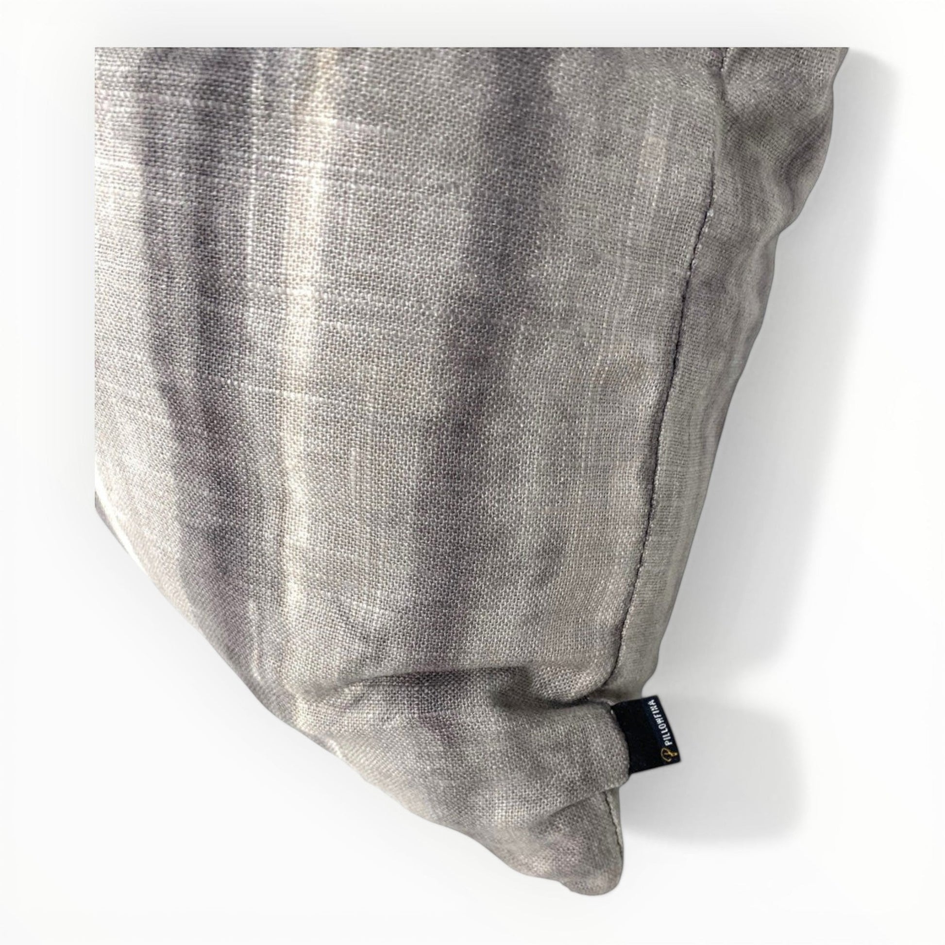close up of ikat stripe upholstery fabric in taupe