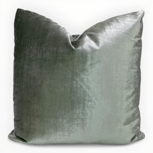 Jaclyn Smith Hollywood velvet throw pillow cover in spruce green on neutral sofa