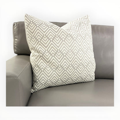Designer Knit throw pillows shown on modern neutral sofa