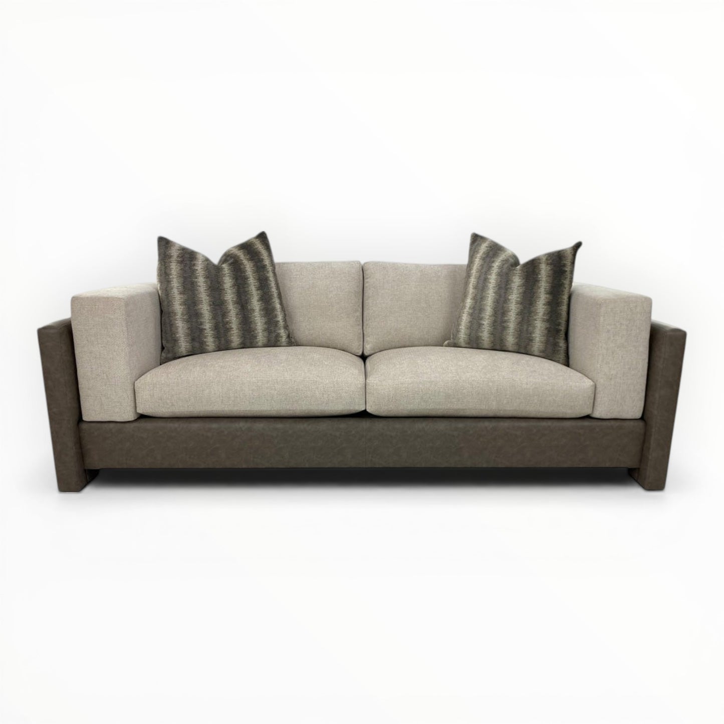 Kravet Couture Canyon Land Iron throw pillows shown on modern sofa