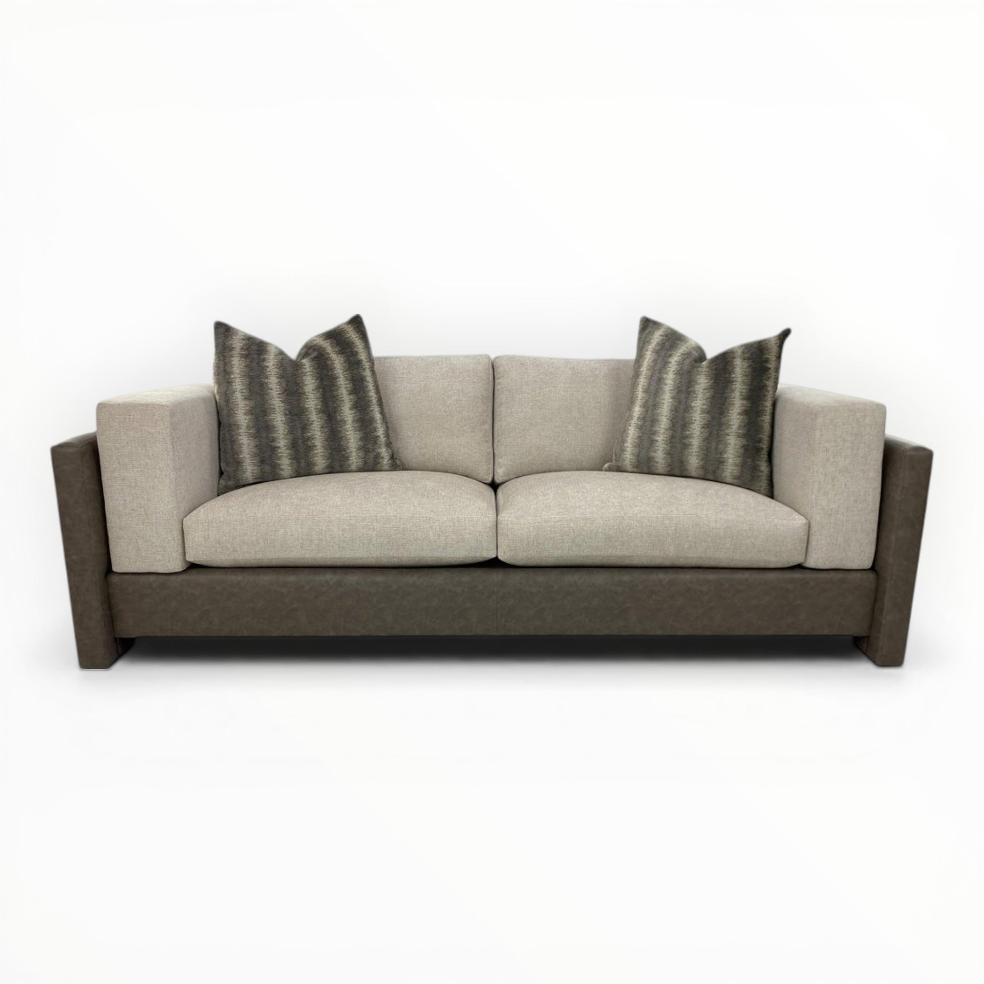Kravet Couture Canyon Land Iron throw pillows shown on modern sofa