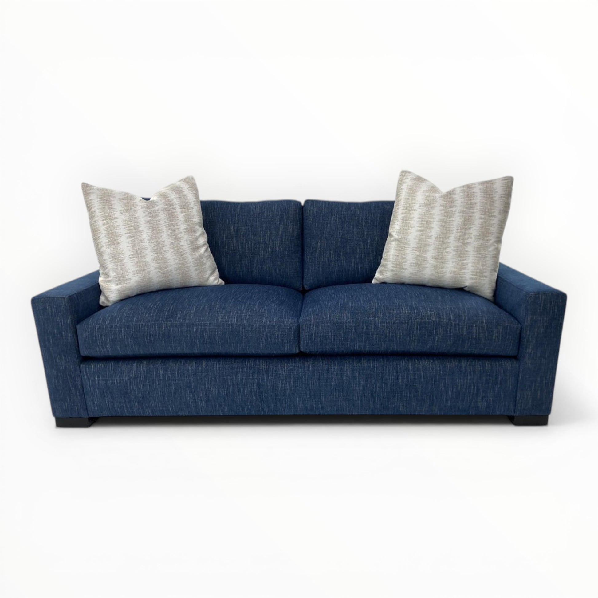 Kravet Couture Canyon Land Throw Pillows on navy sofa