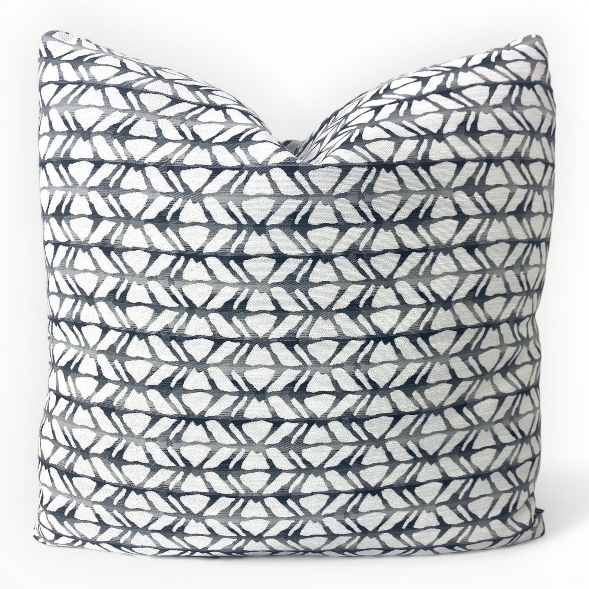 Lazar Bucca throw pillow cover in ink with geometric pattern on neutral sofa