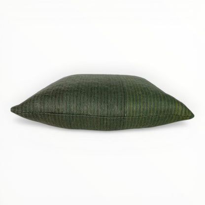 neutral interior styled with green textured pillow