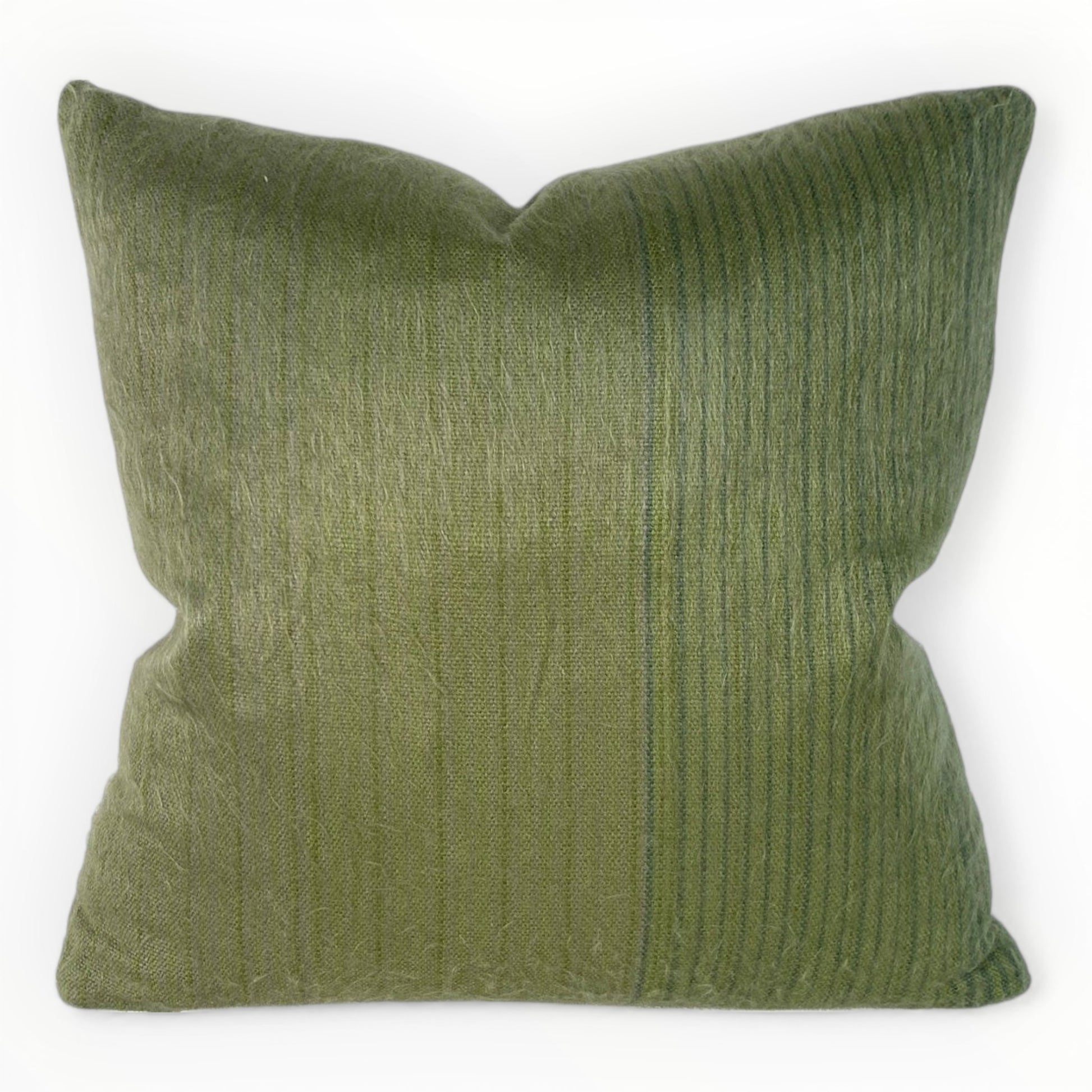 neutral interior styled with green textured pillow