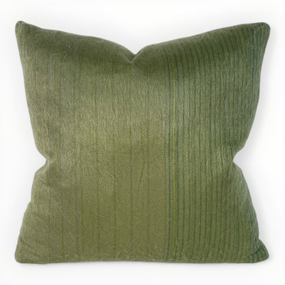 neutral interior styled with green textured pillow