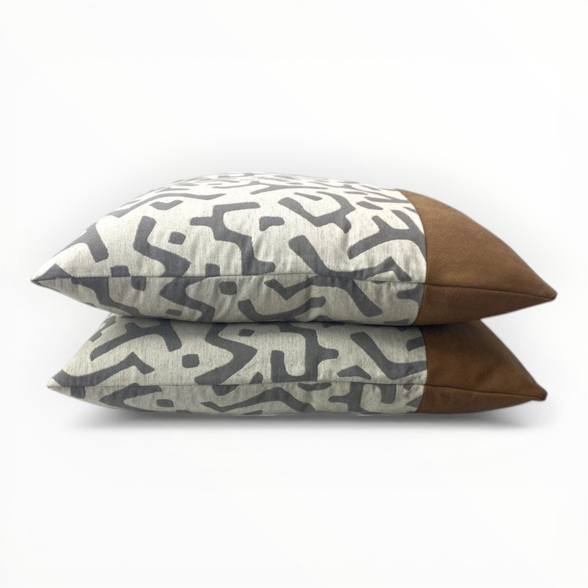 textured jacquard throw pillow with abstract pattern and leather trim