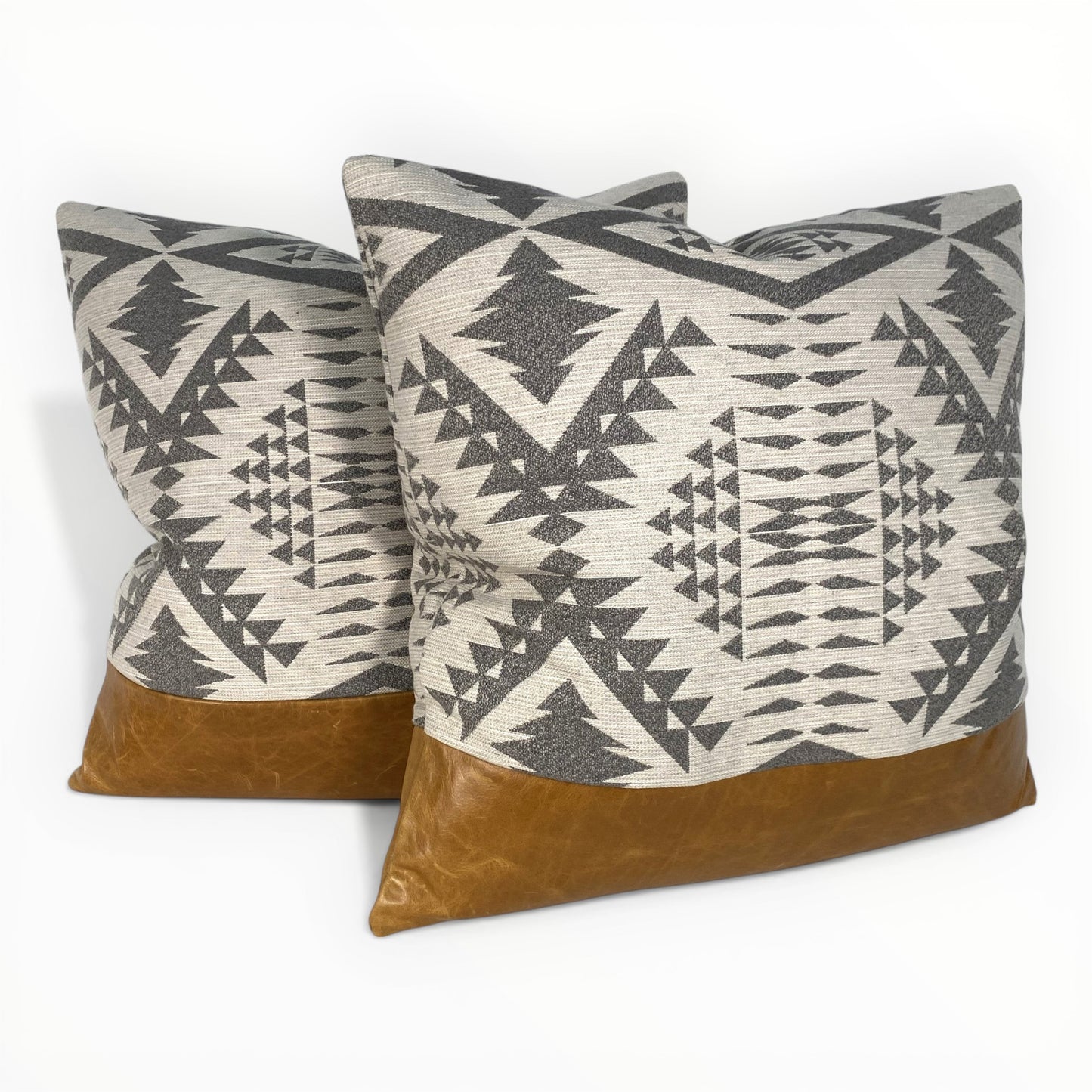 designer indoor outdoor pillow styled on neutral sofa
