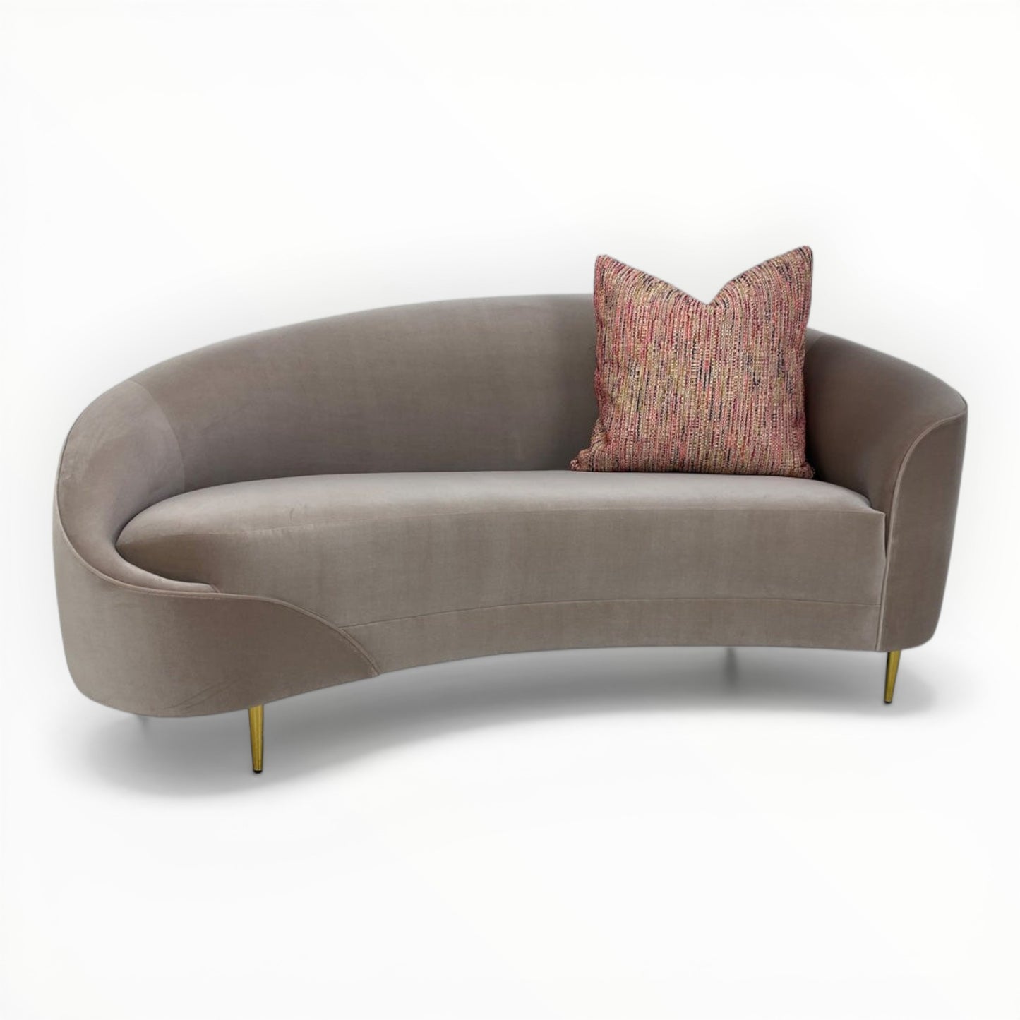 Nobilis Rue Cambon throw pillows shown on modern curved sofa