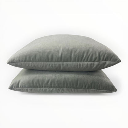 velvet fabric detail showing plush texture and light reflection in pale jade