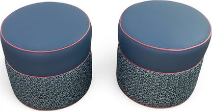 Pillowfina slate blue leather ottoman stool with peacock woven lacing base and watermelon velvet welt trim.