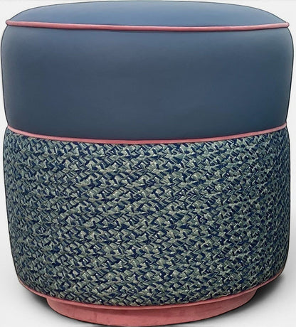 Pillowfina slate blue leather ottoman stool with peacock woven lacing and watermelon velvet welt trim.