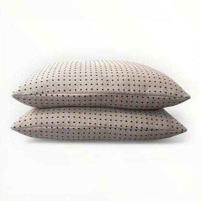woven fabric detail showing geometric pixel pattern in black and neutral tones