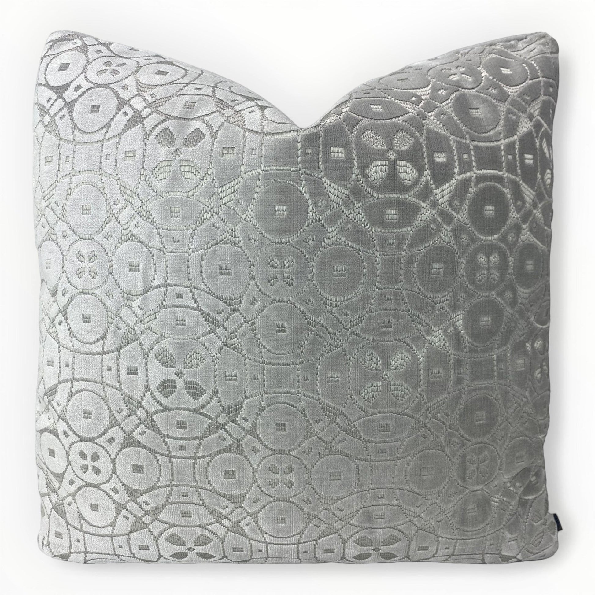 schumacher zodiac velvet throw pillow cover in platinum on sofa